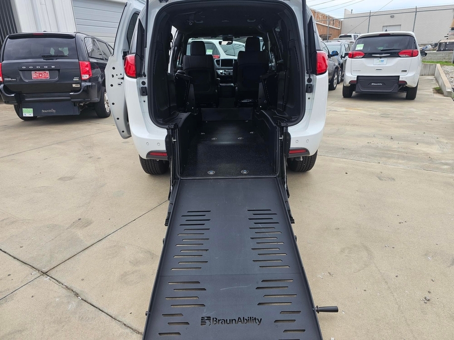 White Chrysler Voyager with Rear Entry Manual Fold Out ramp