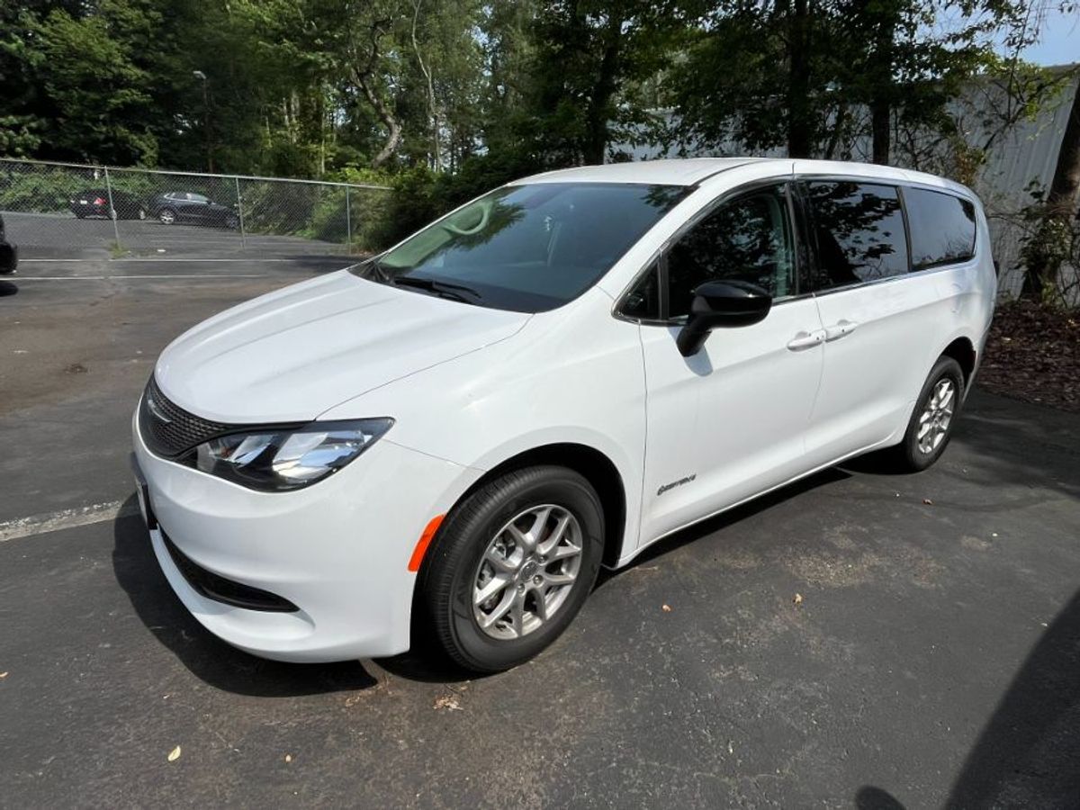 White Chrysler Voyager with Side Entry Automatic Fold Out ramp