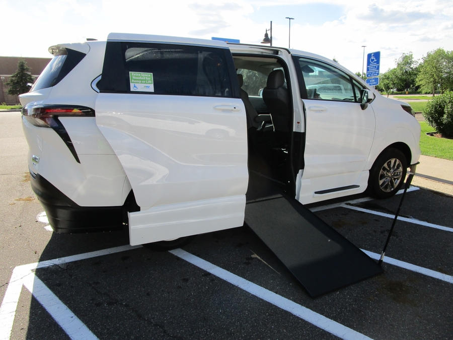 White Toyota Sienna with Side Entry Manual Fold Out ramp