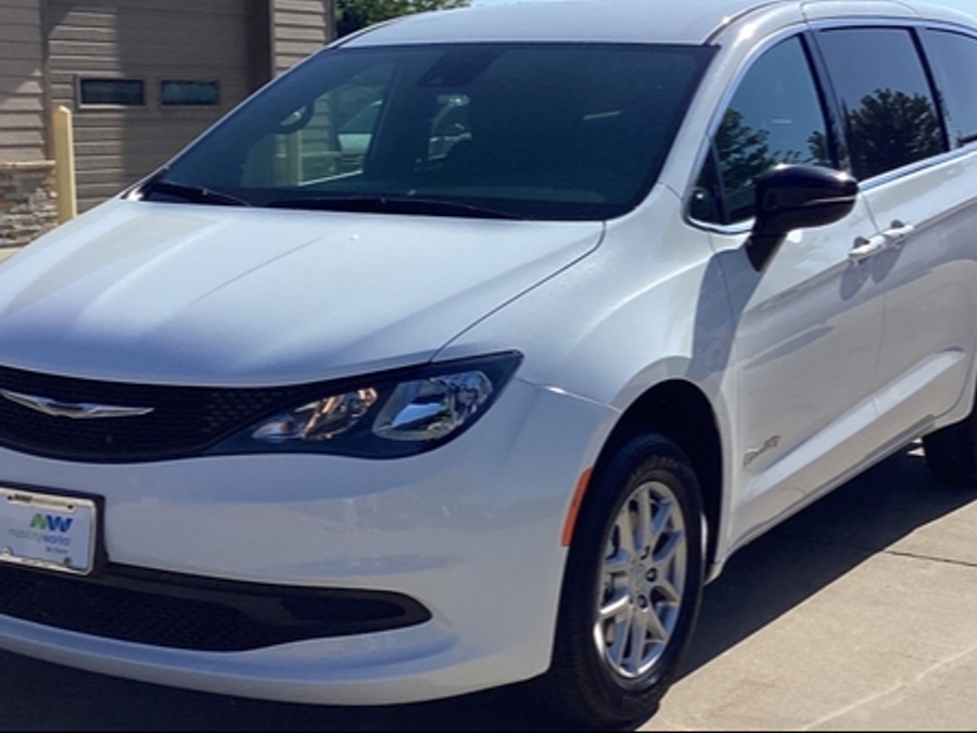 White Chrysler Voyager with Rear Entry Manual Fold Out ramp