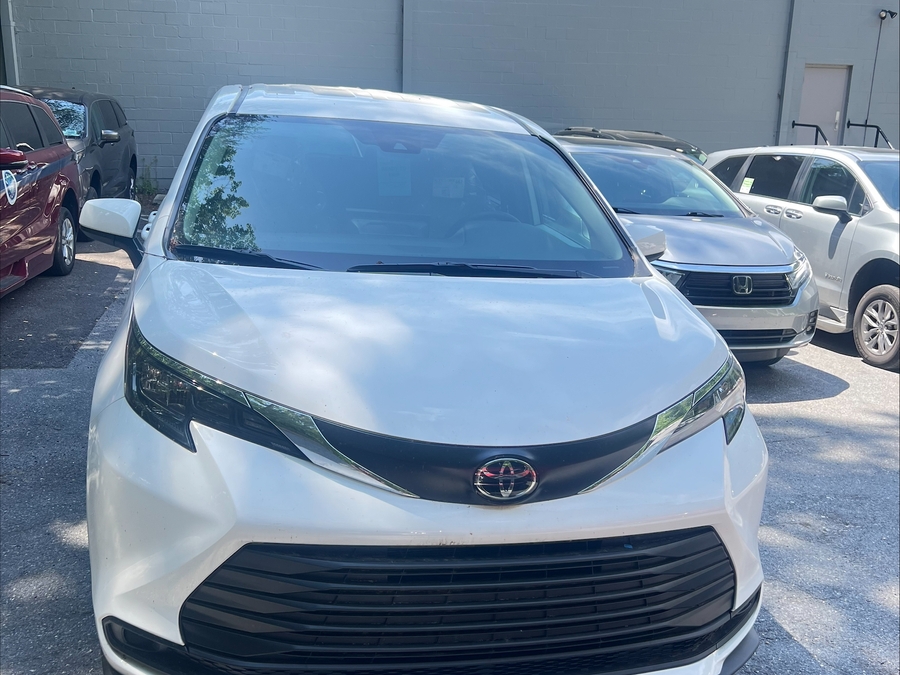 White Toyota Sienna with Rear Entry Manual Fold Out ramp