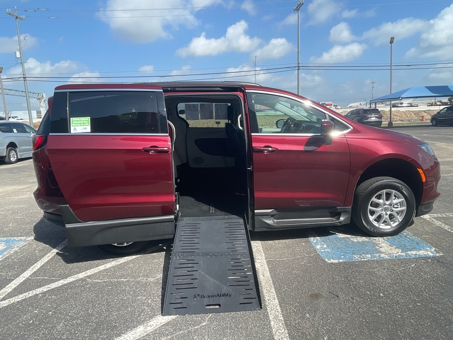 Red Chrysler Voyager with Side Entry Manual Fold Out ramp