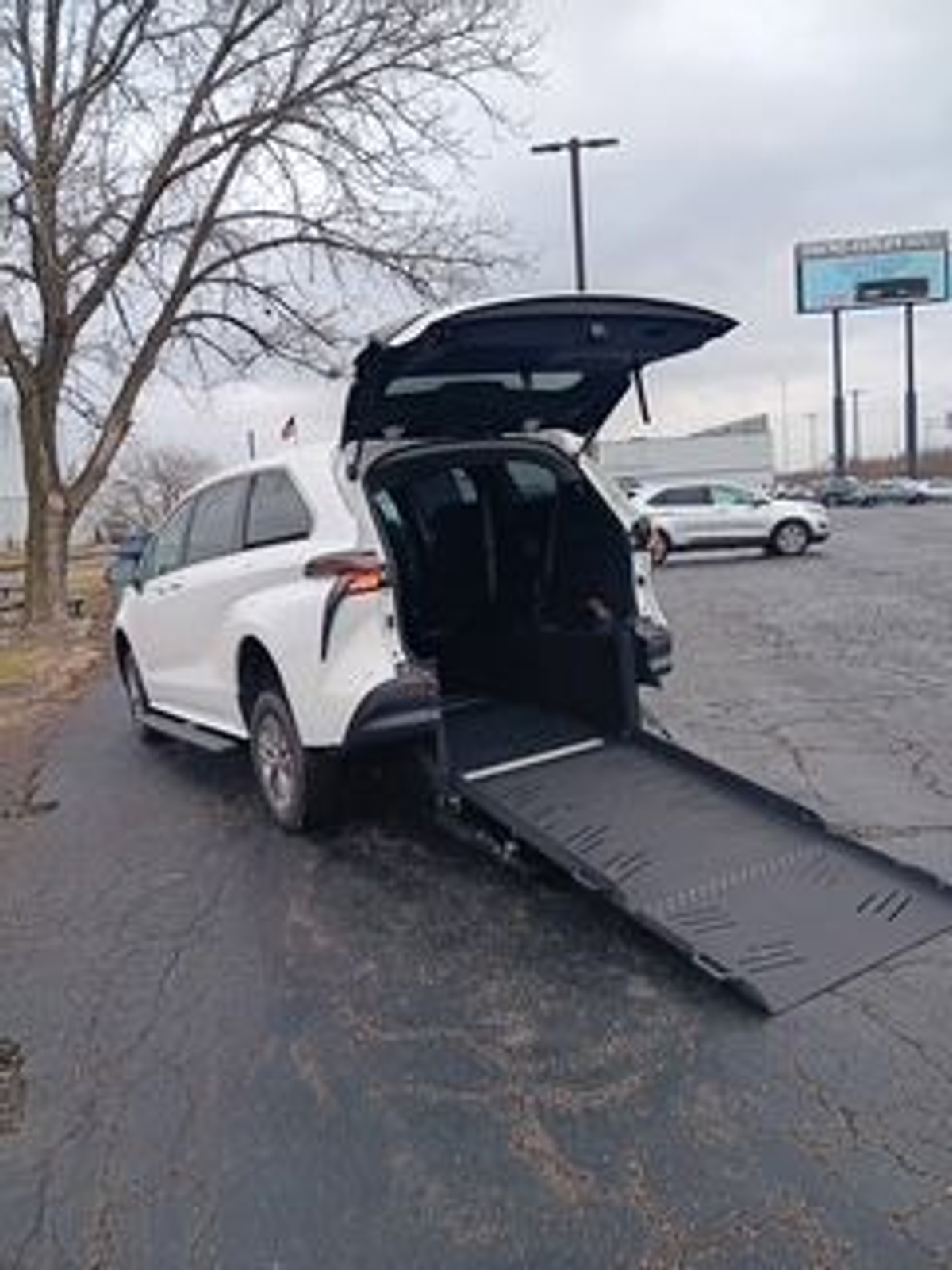 White Toyota Sienna with Rear Entry Manual Fold Out ramp