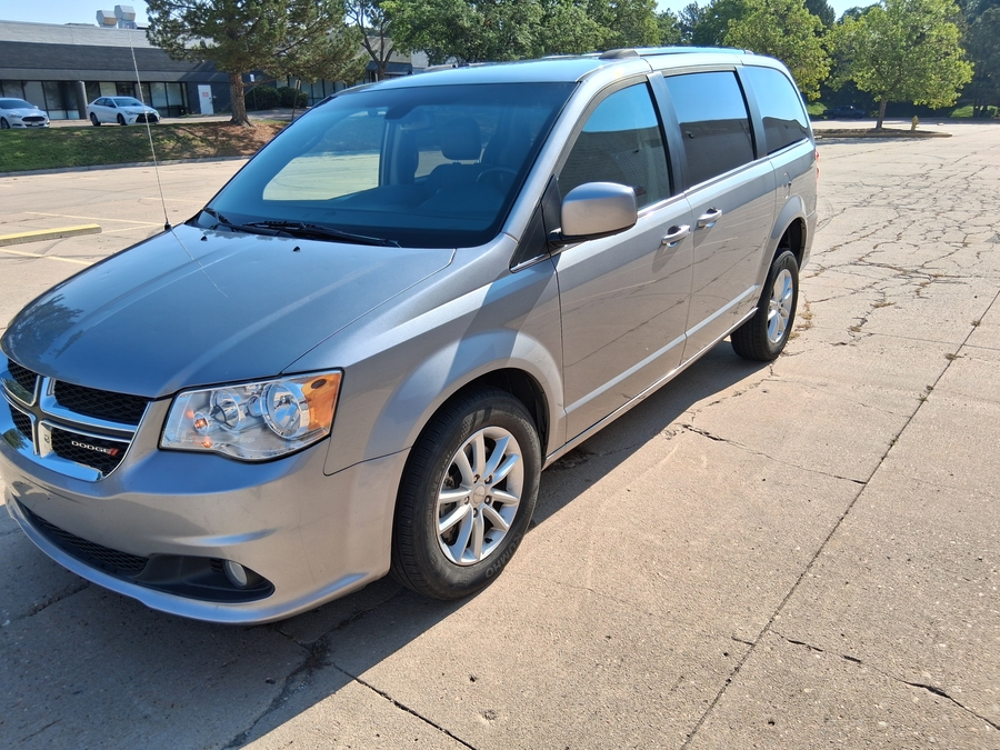 Silver Dodge Grand Caravan with Side Entry Automatic Fold Out ramp