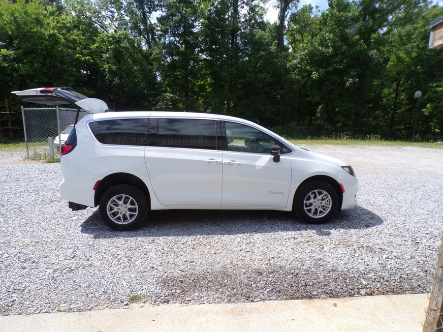 White Chrysler Voyager with Rear Entry Manual Fold Out ramp
