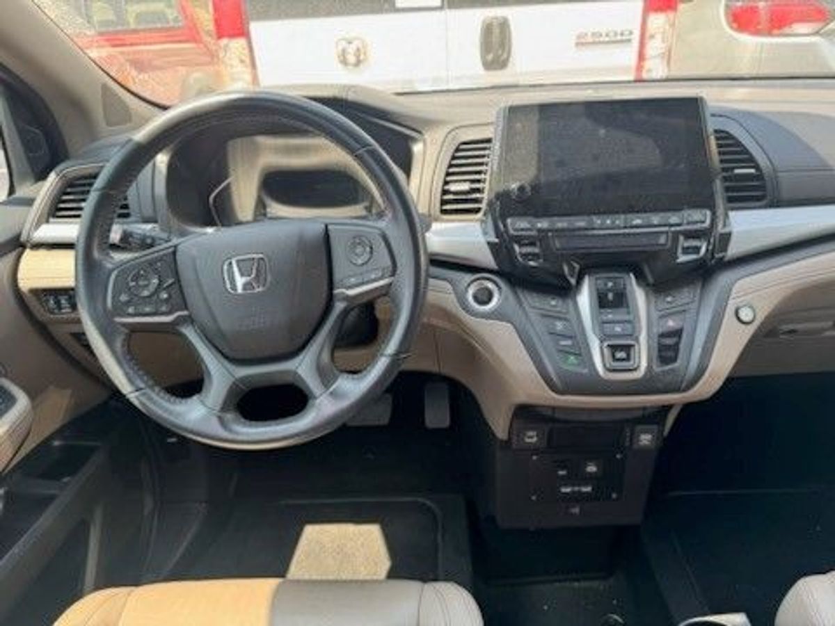 Red Honda Odyssey with Side Entry Automatic In Floor ramp