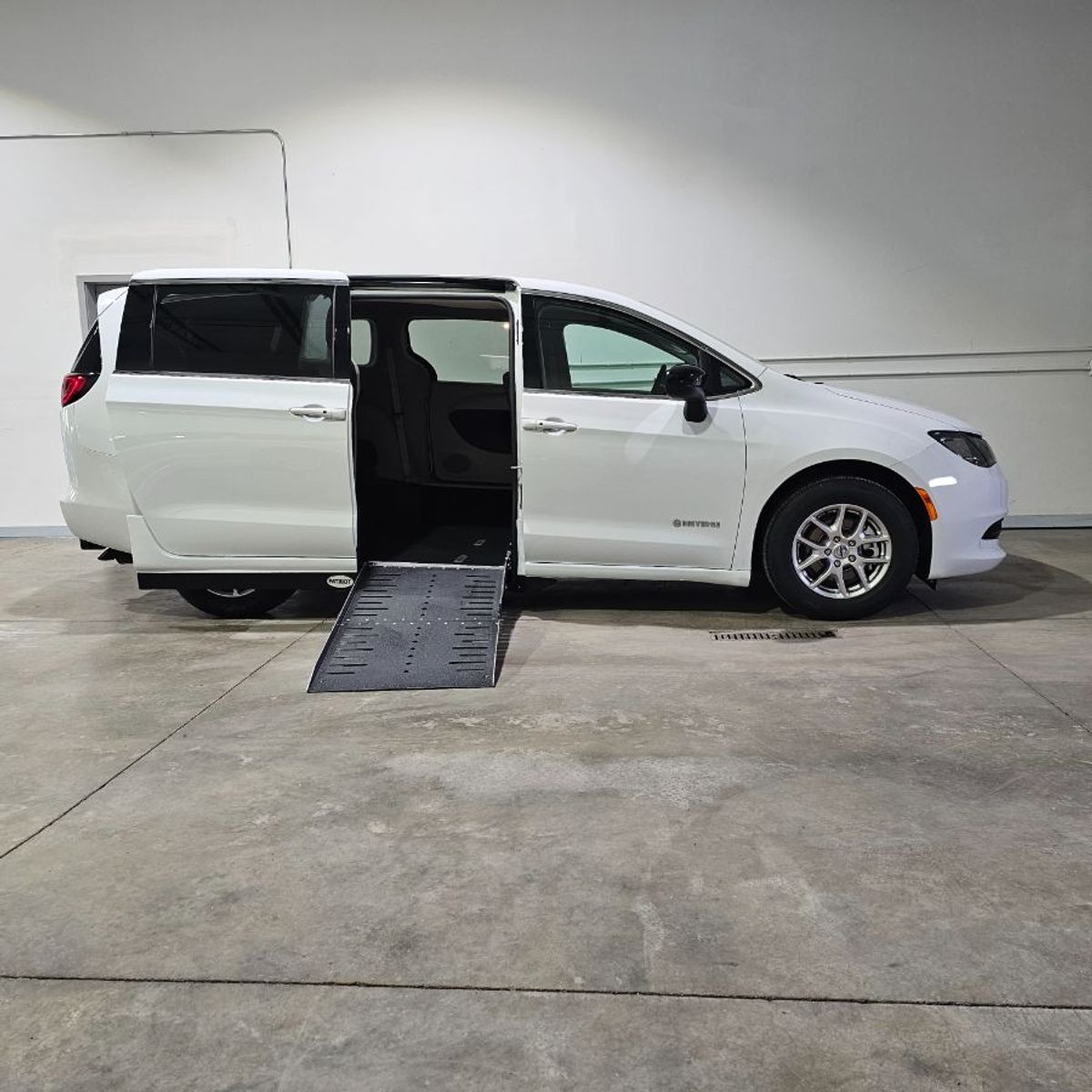 White Chrysler Voyager with Side Entry Automatic Fold Out ramp