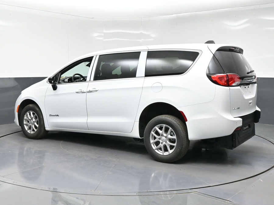 White Chrysler Voyager with Rear Entry Manual Fold Out ramp