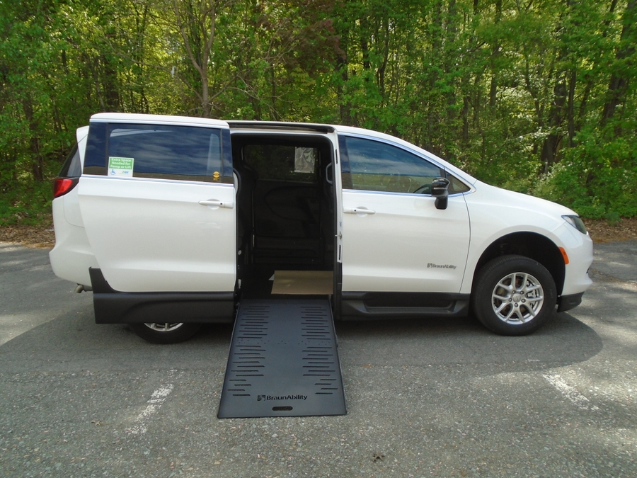 White Chrysler Voyager with Side Entry Manual Fold Out ramp