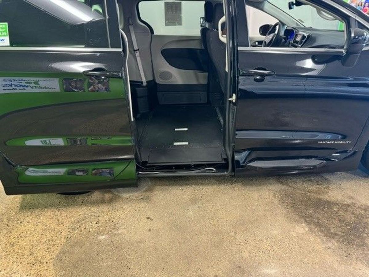 Black Chrysler Voyager with Side Entry Automatic In Floor ramp