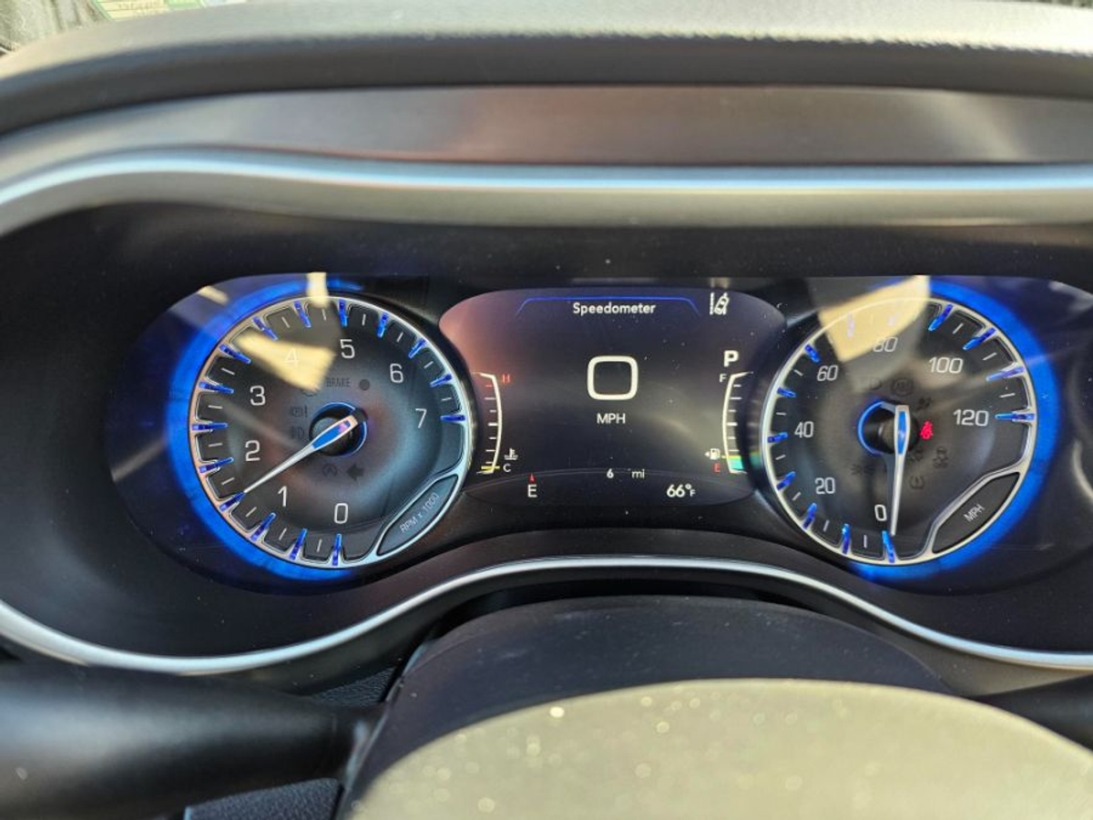 White Chrysler Voyager with Side Entry Manual Fold Out ramp