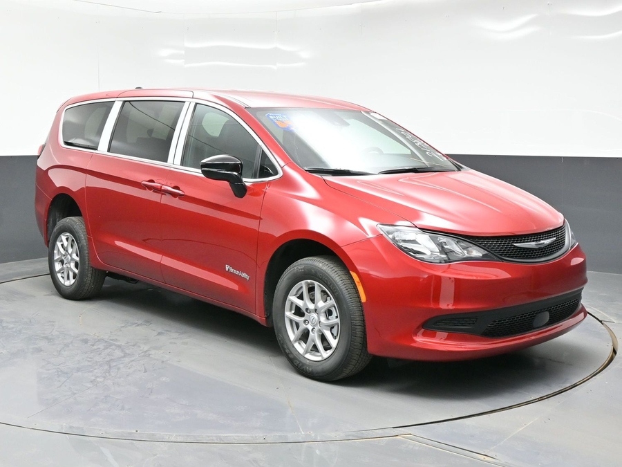 Red Chrysler Voyager with Rear Entry Manual Fold Out ramp