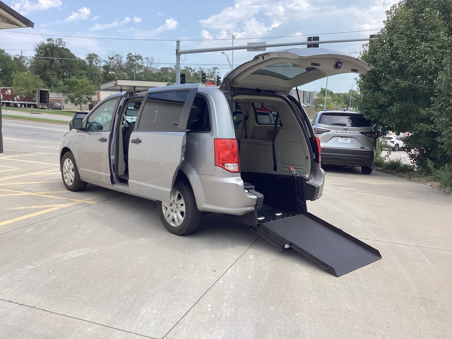 Silver Dodge Grand Caravan with Rear Entry Manual Fold Out ramp