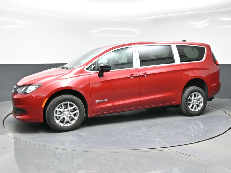 Red Chrysler Voyager with Rear Entry Manual Fold Out ramp