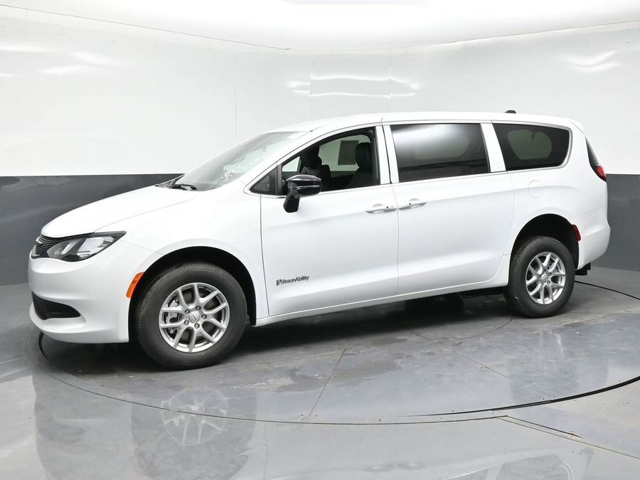 White Chrysler Voyager with Rear Entry Manual Fold Out ramp