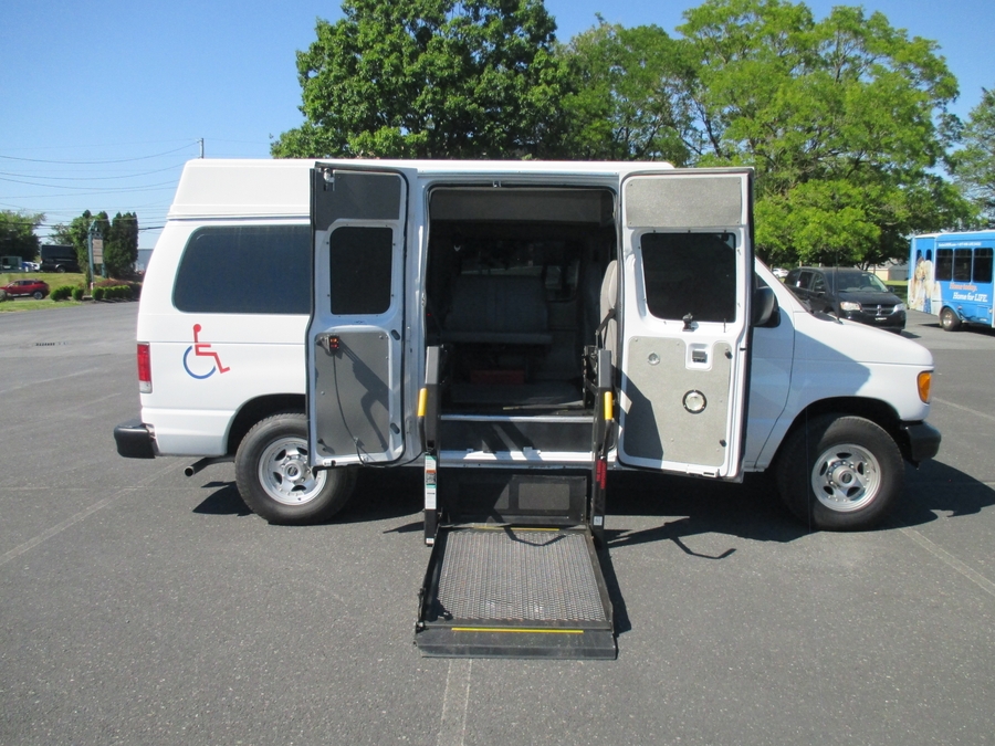 White Ford Econoline with Side Entry Automatic Fold Out ramp