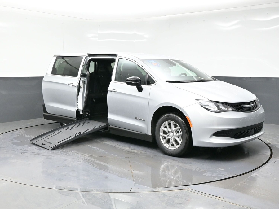 Silver Chrysler Voyager with Side Entry Manual Fold Out ramp