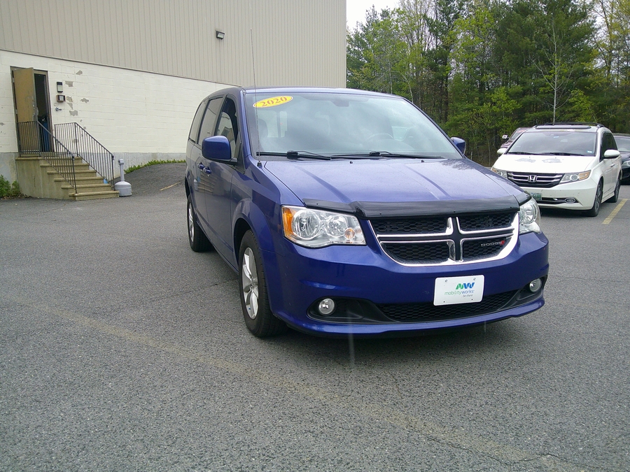 Blue Dodge Grand Caravan with Rear Entry Manual Fold Out ramp