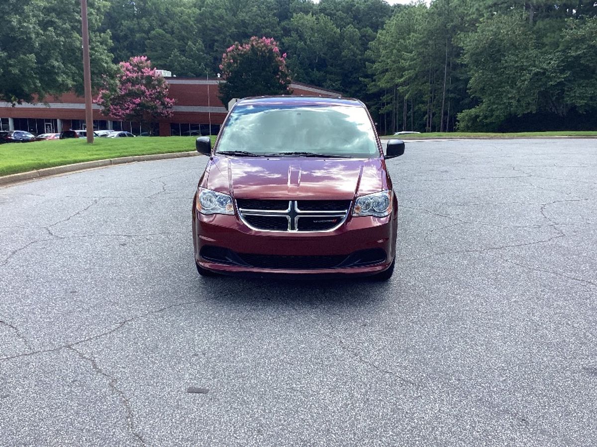 Red Dodge Grand Caravan with Side Entry Automatic Fold Out ramp