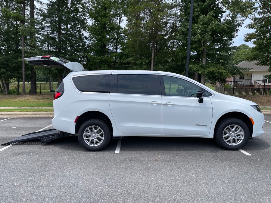 White Chrysler Voyager with Rear Entry Manual Fold Out ramp