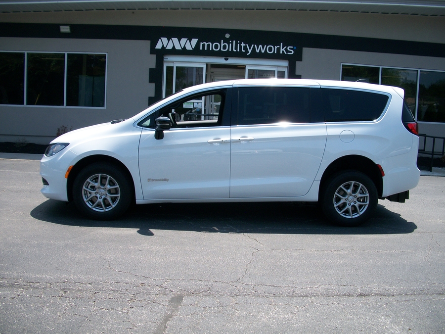 White Chrysler Voyager with Rear Entry Manual Fold Out ramp