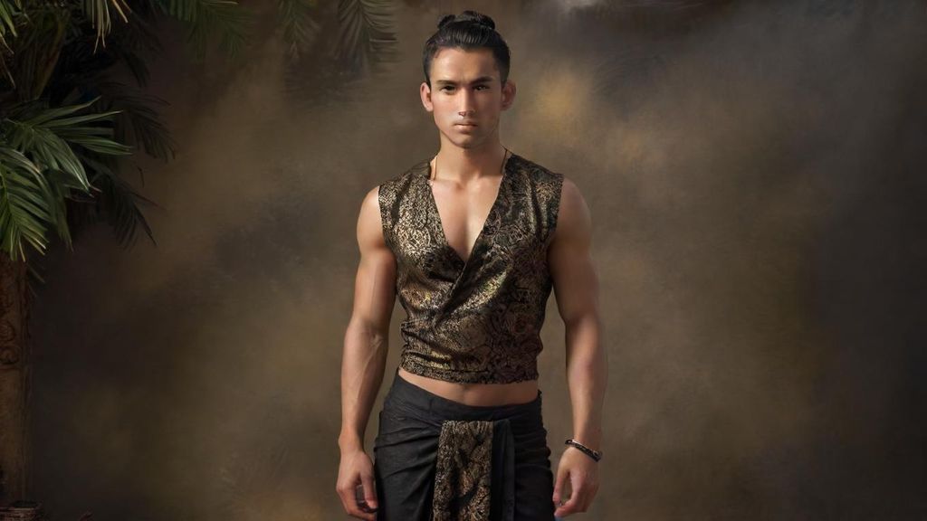 Cinematic hyperrealistic full-body ultra realistic ultra detailed wide shot of a handsome young man with black hair tied in a bun, wearing a sleeveless black outfit with golden lace, bare chest, brown batik sarong, and royal jewelry, riding a colossal Garuda with radiant golden feathers and royal ornaments, facing a terrifying giant creature in a rocky green valley. The creature is full-body, massive and muscular, with long wavy black hair, sharp fangs, bare chest, wearing a brown batik sarong and royal jewelry, exuding power and menace. Behind the giant, a full-body army of similar terrifying beings stands in formation, filling the valley with an overwhelming presence. The Garuda spreads its wings wide, golden feathers rendered in intricate detail, jewelry sparkling realistically. Ultra detailed textures on skin, muscles, feathers, fabrics, and rocky terrain. Dramatic cinematic lighting, mist rising between green hills and stone cliffs, epic atmosphere, mythical and legendary tone, ultra sharp 8K realism.