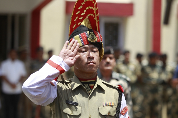 An Indian Border Security Force (BSF) soldier pays tribute to four of their colleagues who were killed early Wednesday during a wreath-laying ceremony at the BSF headquarters in Jammu, India, Wednesday, June 13, 2018. Indian and Pakistani forces fired along the highly militarized frontier in disputed Kashmir early Wednesday after Pakistani firing killed at least four Indian paramilitary soldiers and injured three others on border patrol, Indian officials said. (AP Photo/Channi Anand)