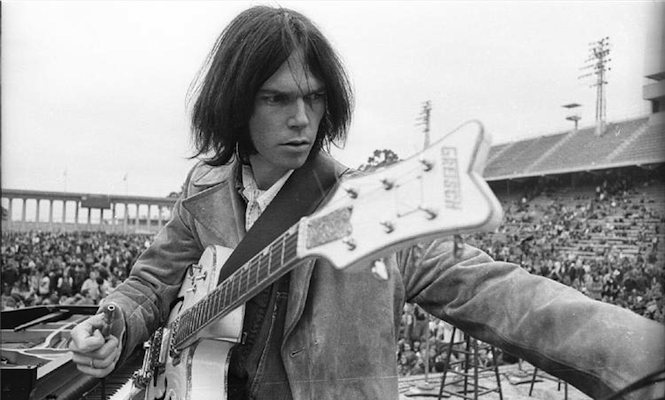 neil-young-busts-record-shop-for-selling-csn-breaks-candle-in-protest
