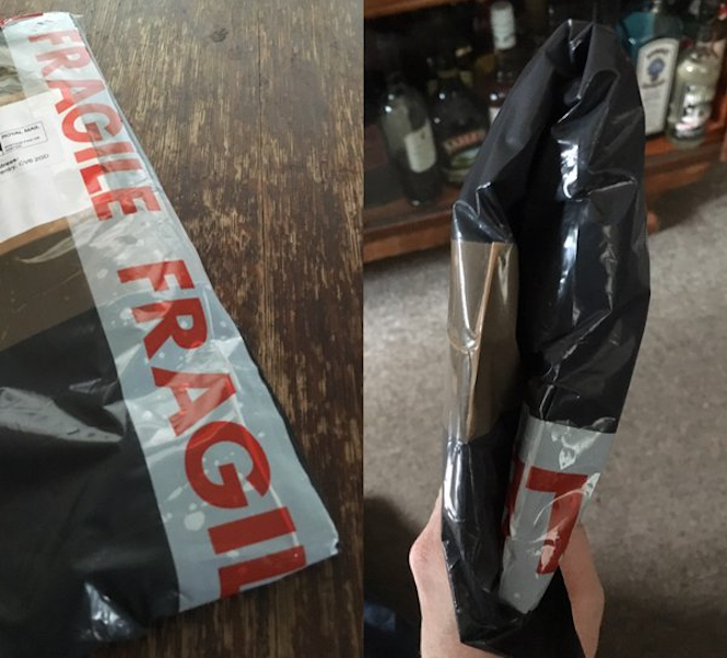 Postman folds vinyl record in half and delivers it through the mailbox