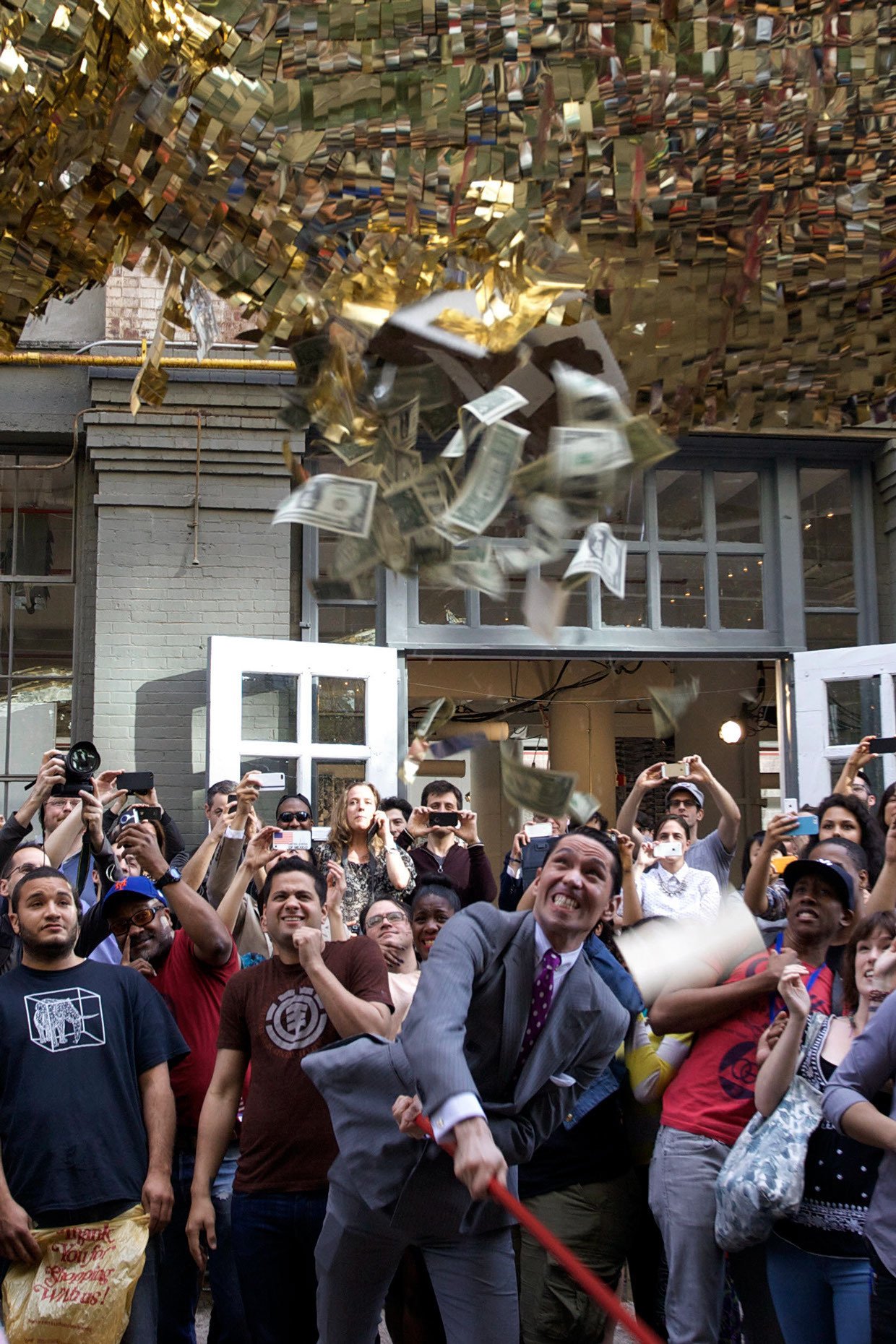 Sebastian Errazuriz bashes open his piñata piece, XXth Century.