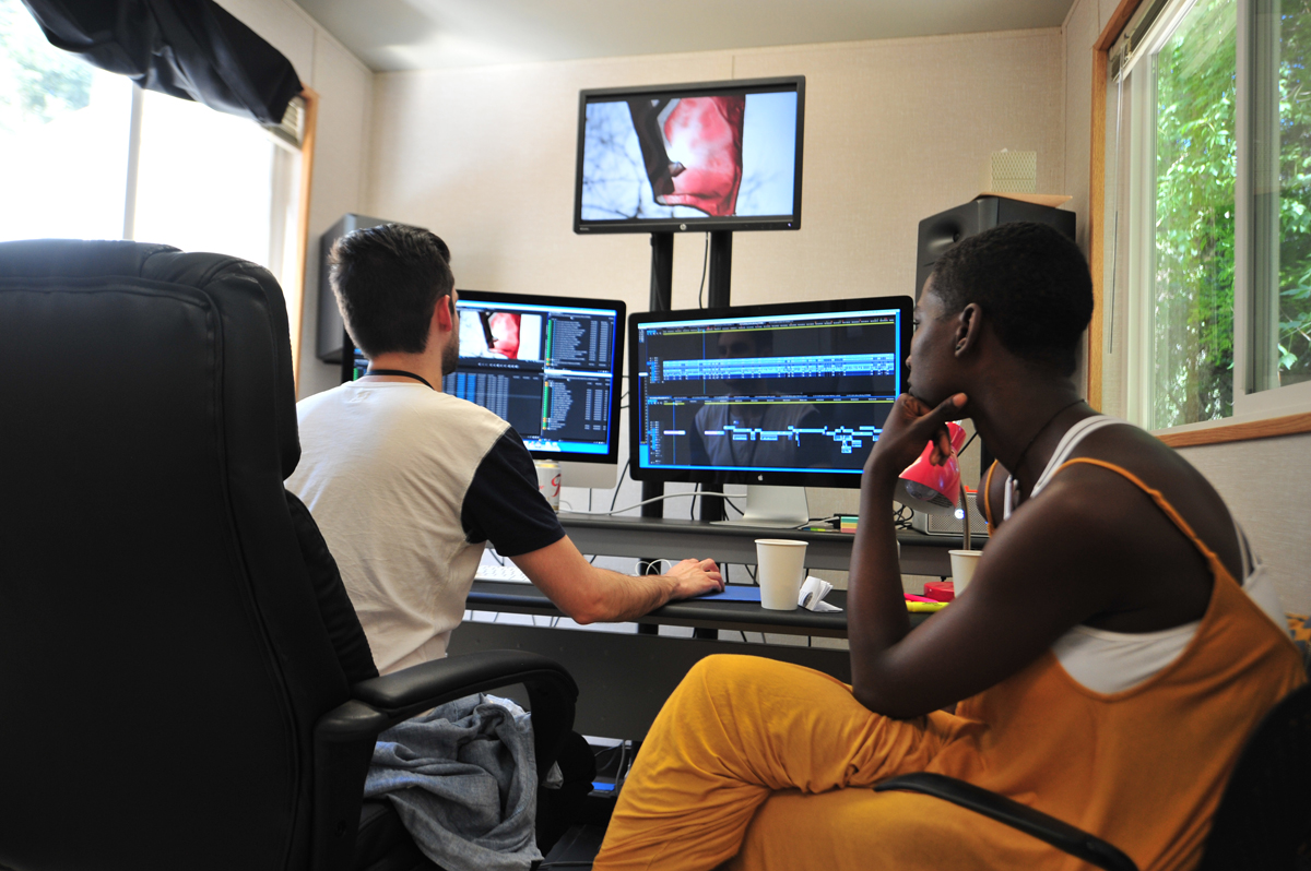 Christopher McNabb, Damon Davis and Sabaah Folayan work on "Whose Streets?" at the 2016 Documentary Editing Lab. © 2016 Sundance Institute | Photo by Jonathan Hickerson.