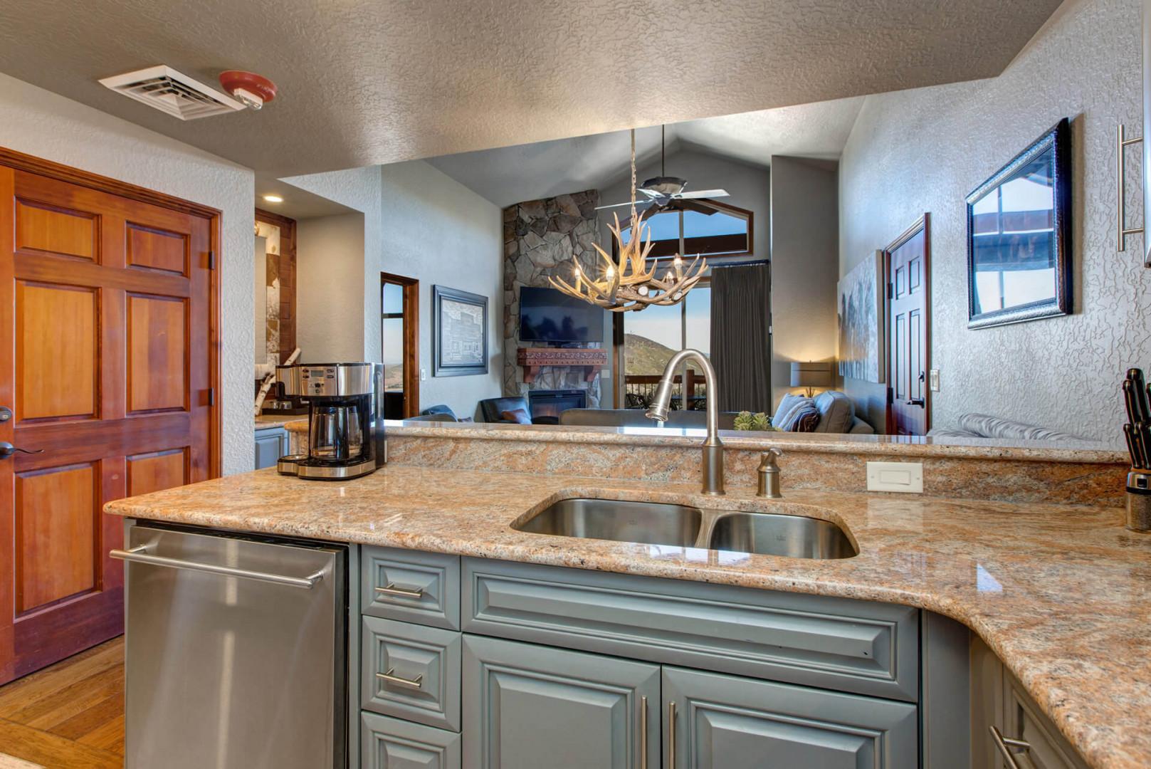 Modern appliances and ample storage in sleek kitchen design.