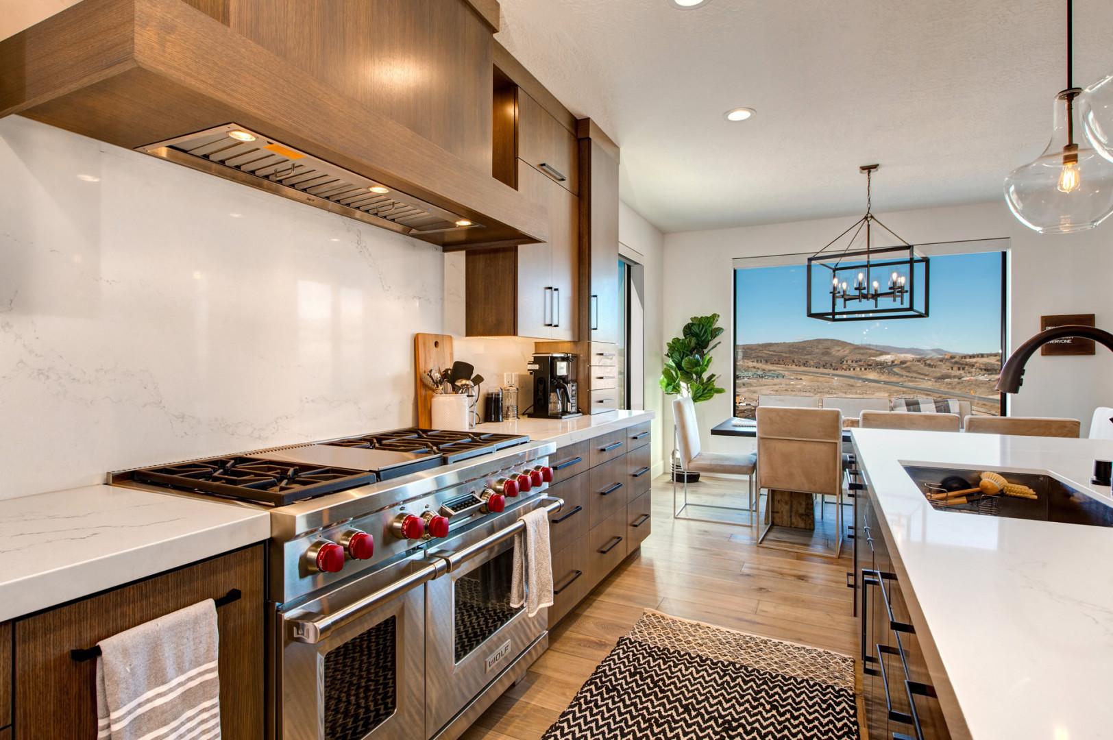 Jordanelle Estates 13201: Modern appliances and ample storage in sleek kitchen design.