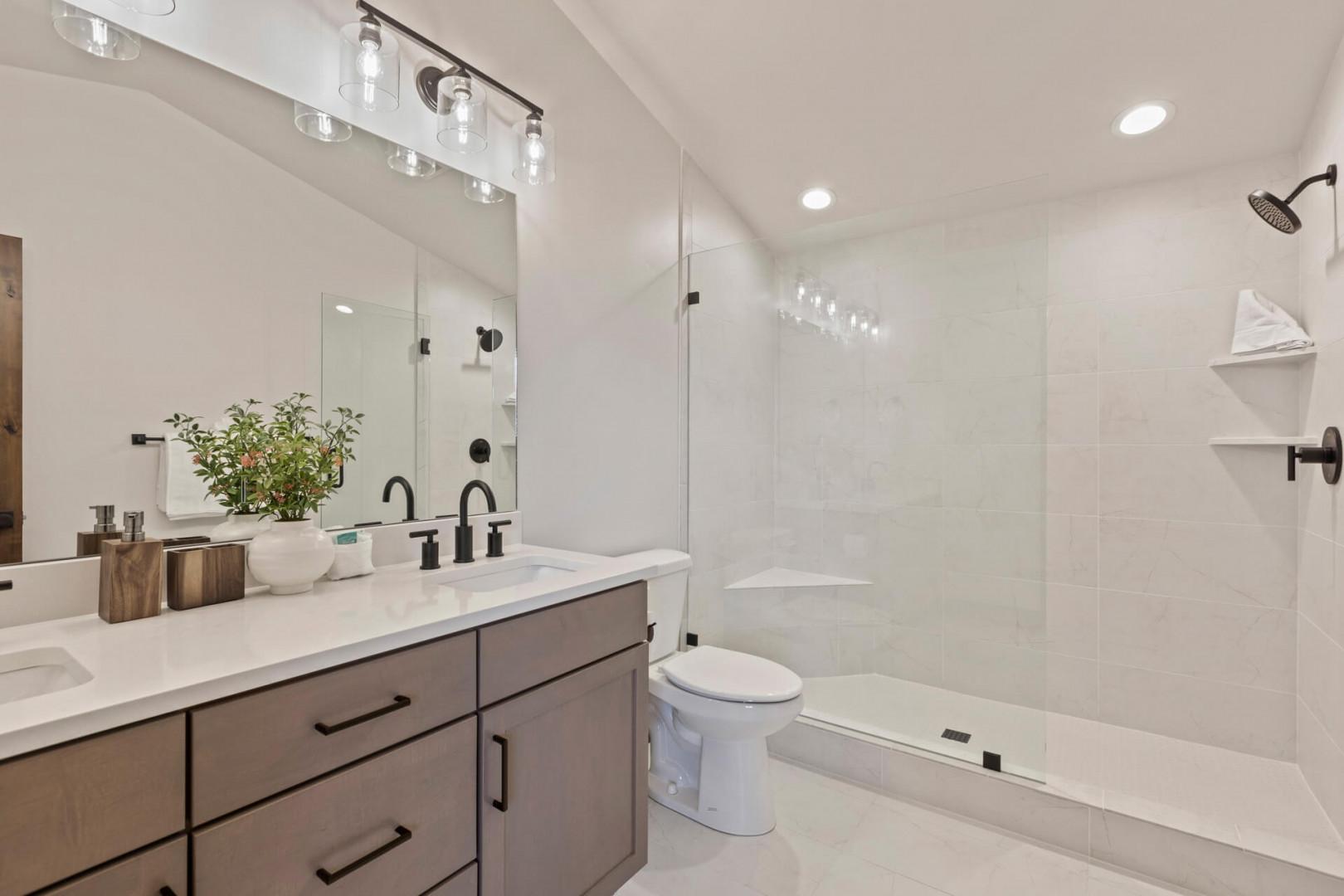 Black Rock Ridge 14488: Sleek sink, mirror, toilet, and shower in modern design.