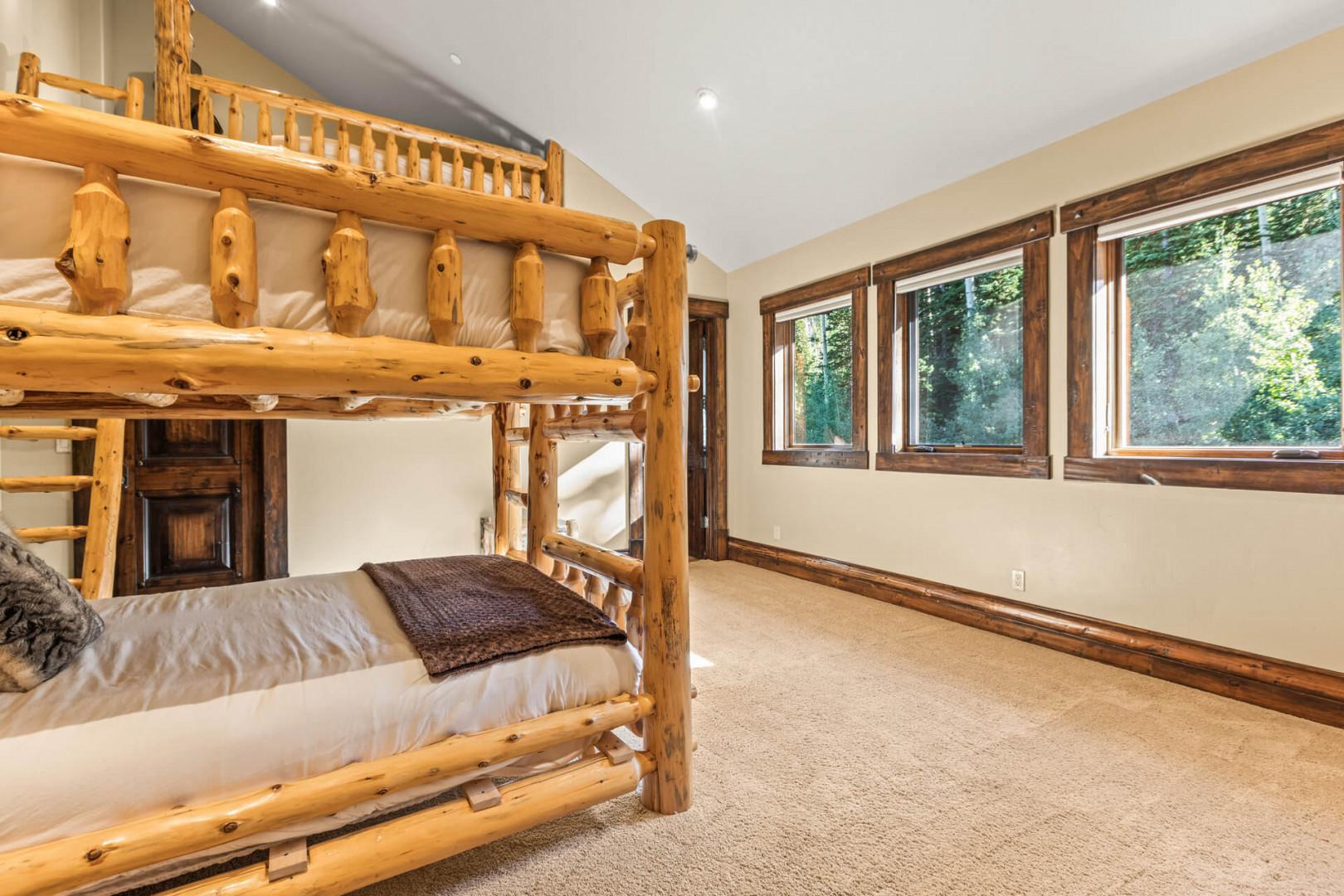 Bunk bed and loft bed, bathroom: "Cozy sleeping space with a view.