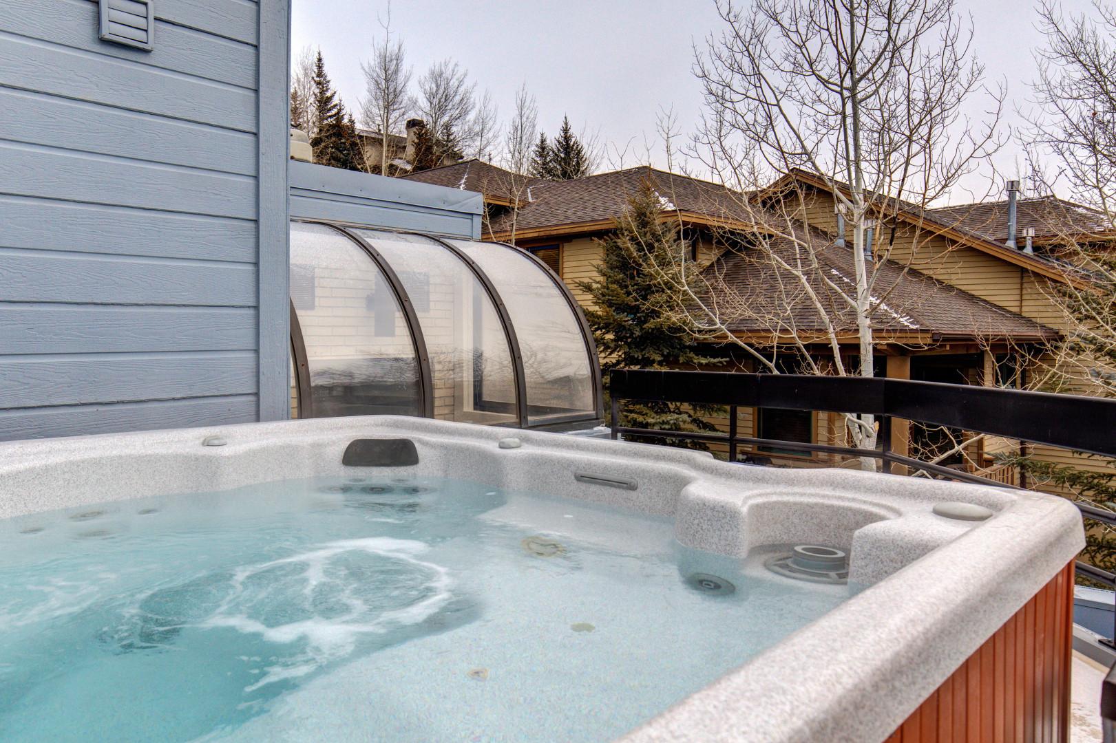 Sunspot 625-A4 - Relax in a private outdoor hot tub with scenic views.