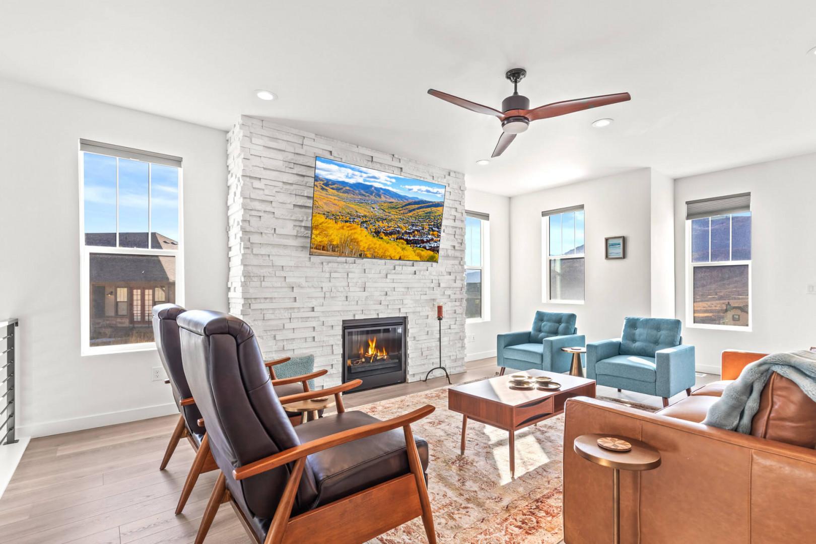 Sink into plush seating by the fireplace as mountain views fill the windows. Your living room invites cozy evenings and bright, sunlit mornings in modern comfort.
