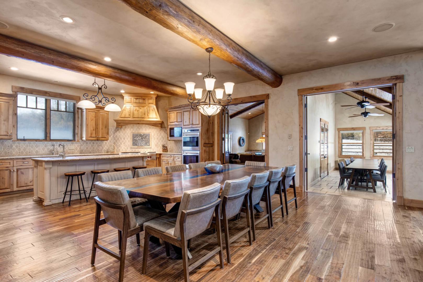 Dining table: "Inviting setting with a view of the kitchen area."