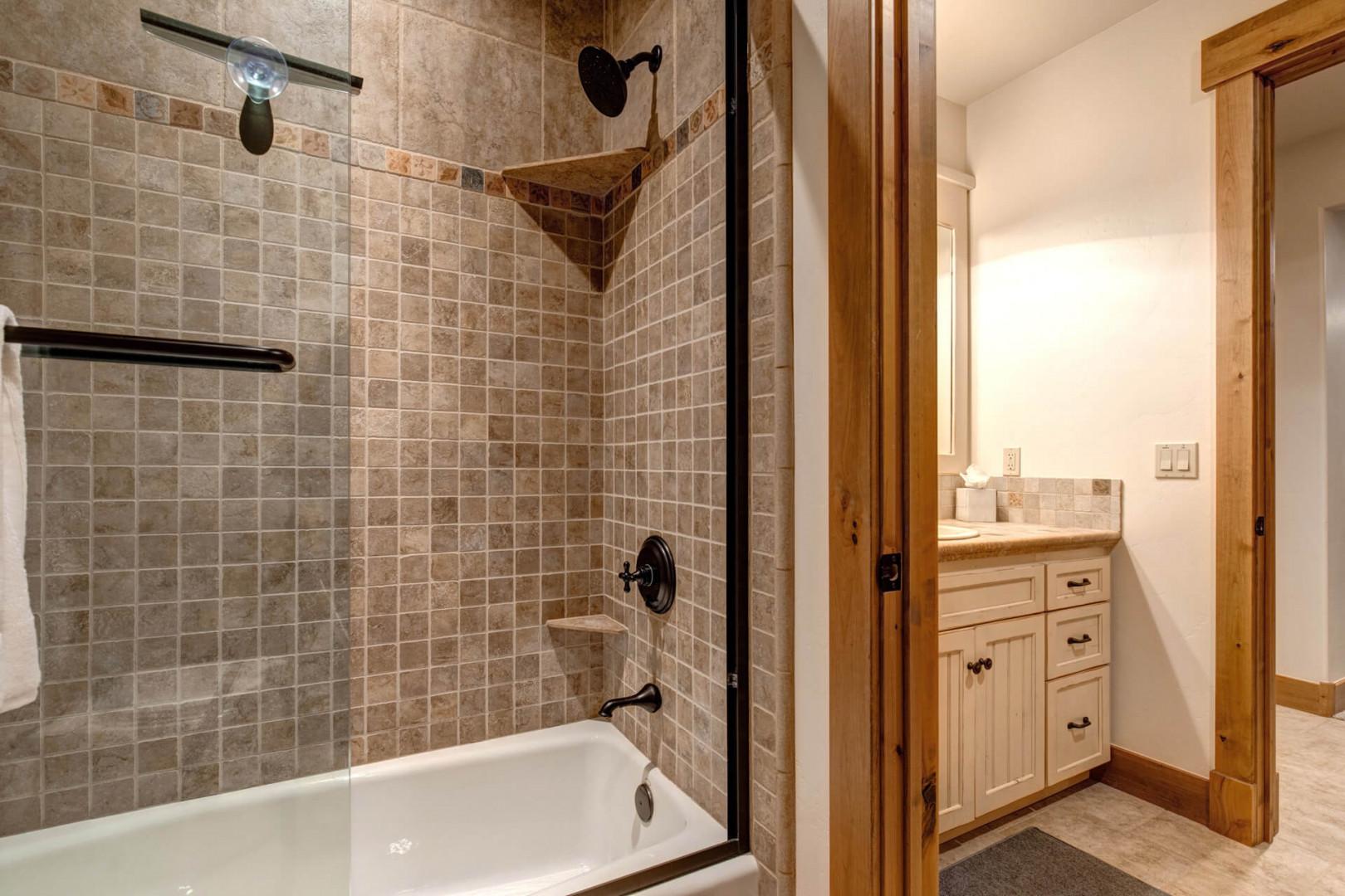 Modern sink and tub shower combo for a luxurious experience.