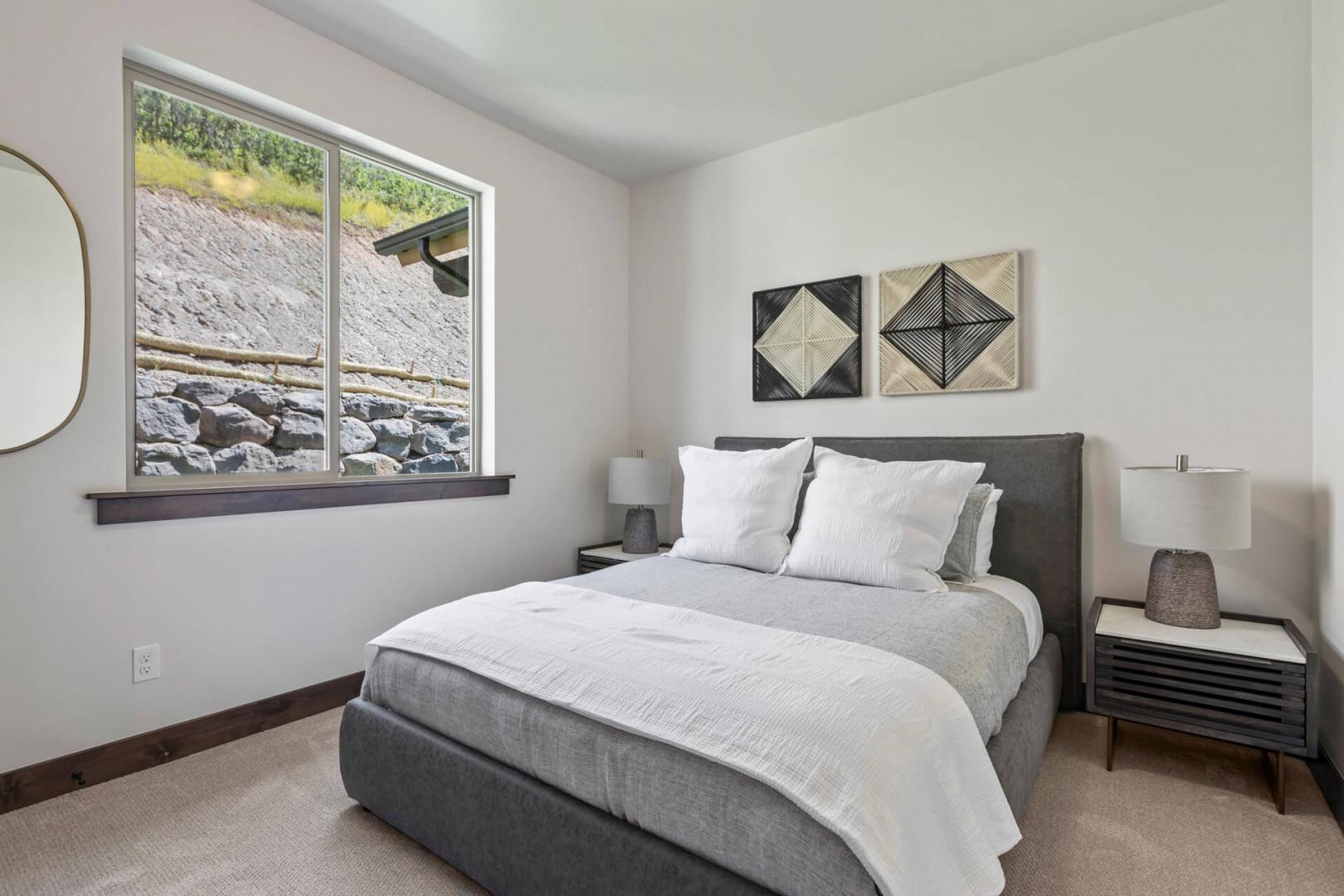 Black Rock Ridge 1448: Cozy bed by the window, perfect for a relaxing afternoon nap.