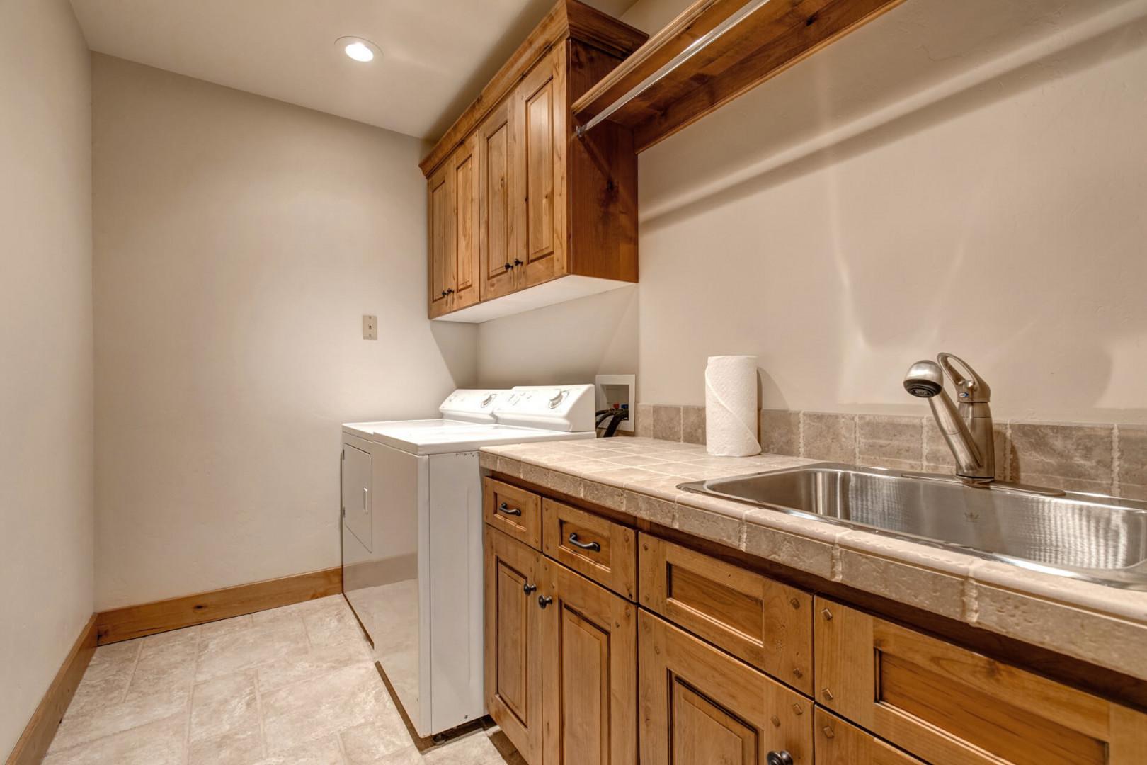 Convenient sink and washing machine combo for easy chores.