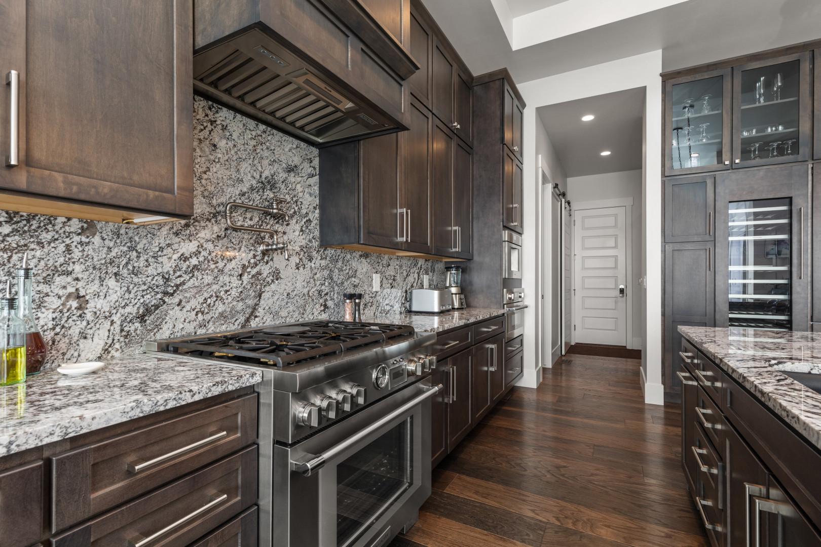 Deer Springs 12797: Modern appliances and ample storage in sleek kitchen design.