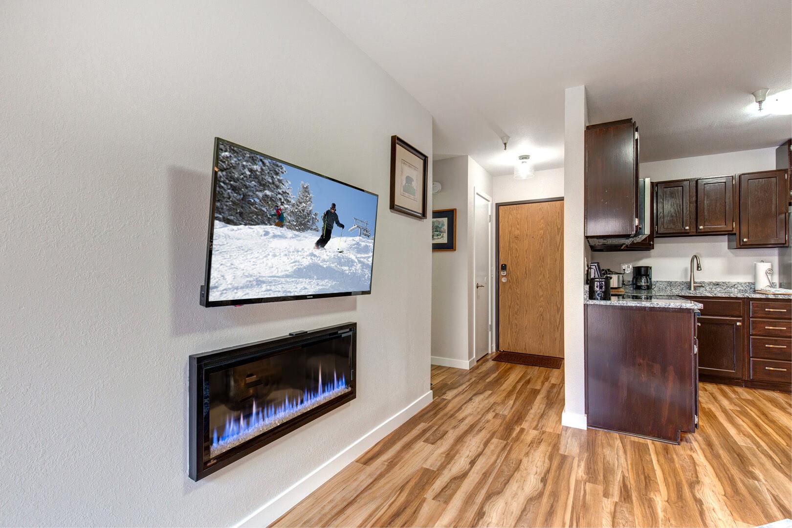 Sleek design with a mounted TV for modern entertainment.