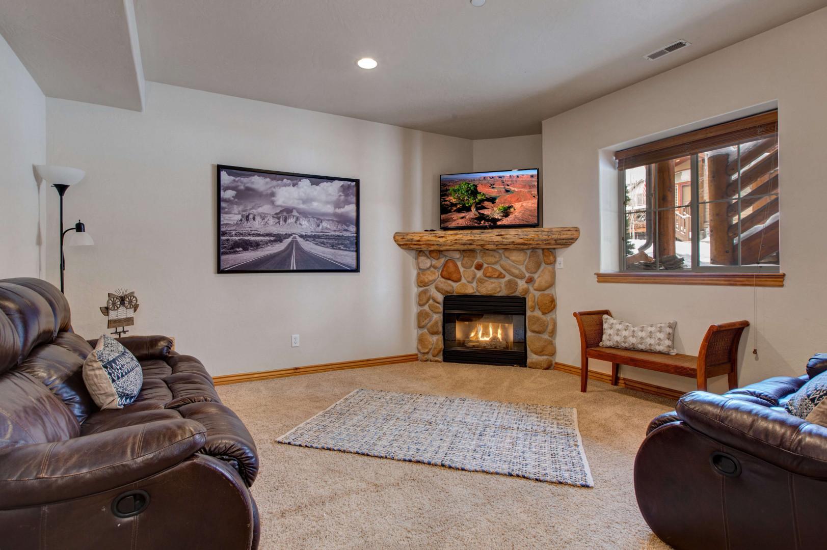 Bear Hollow 5478: Cozy sofa by the fireplace, perfect for relaxing evenings.