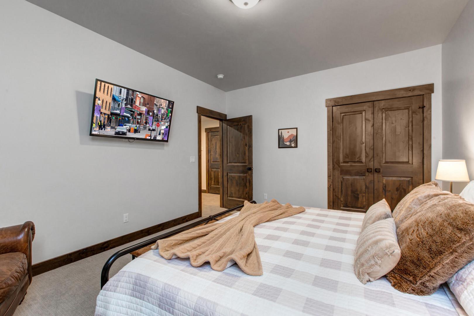 14494 N Asher Way_52: Cozy queen bed with TV for a relaxing stay.