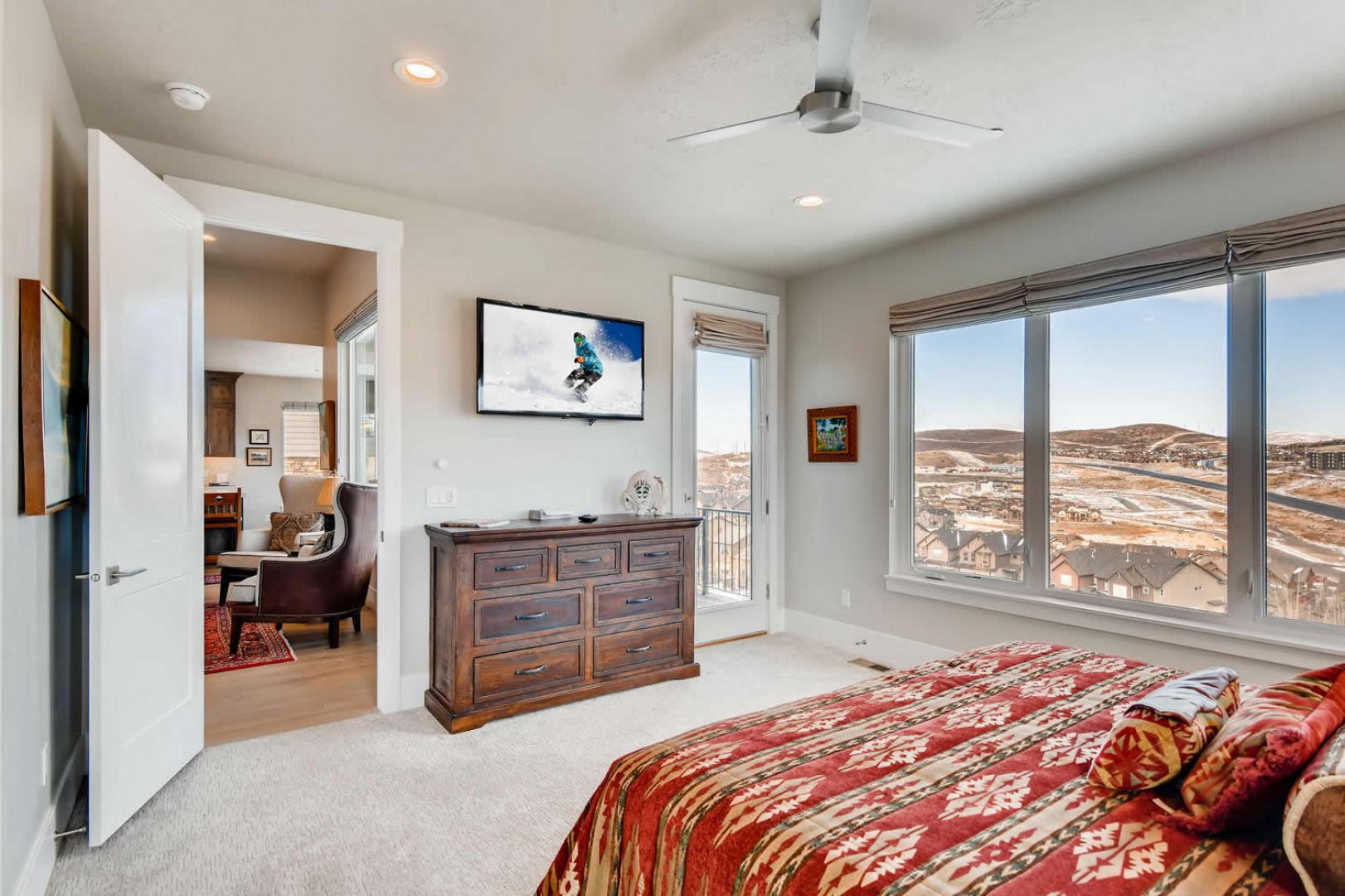 Jordanelle Estates 13299: Cozy bed by the window, perfect for a relaxing afternoon nap.