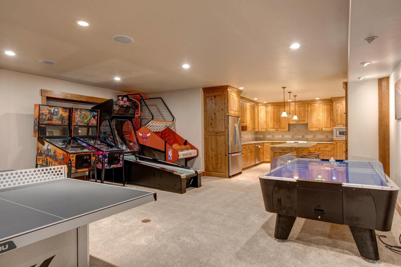 Play Area: "Kitchen and bar table with stools, perfect for entertaining guests."