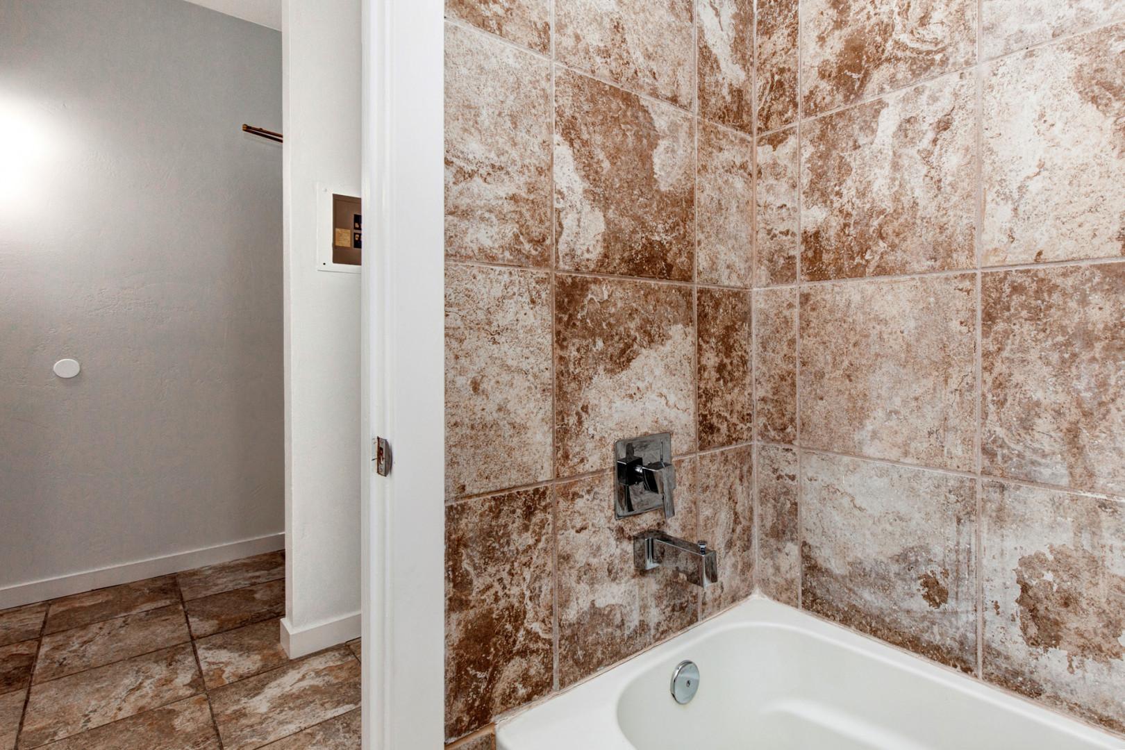 Relaxing soak awaits in this convenient tub shower combo.