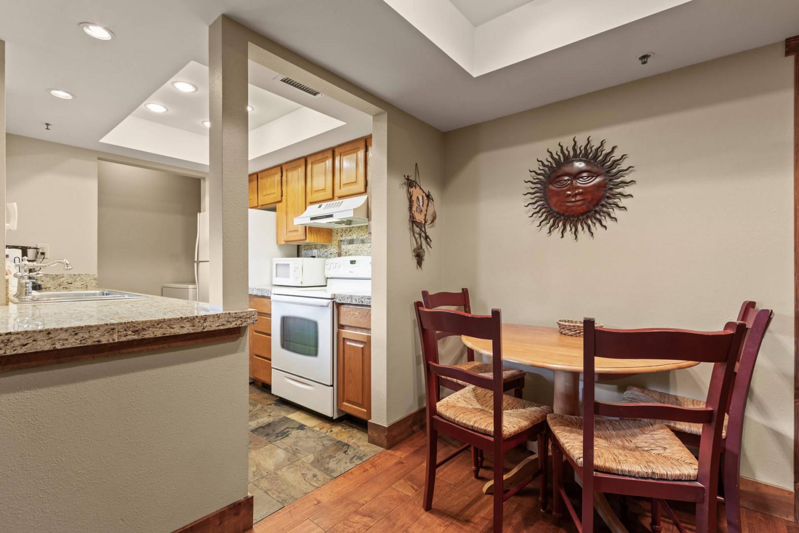 Powderwood 11C: Inviting dining table in a cozy kitchen setting.