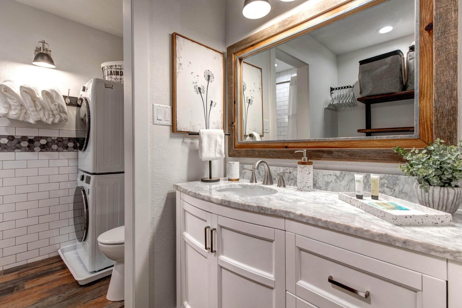 Reflective sink area with a sleek mirror, perfect for morning routines.